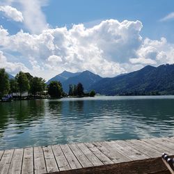 Scenic view of lake and mountains against sky