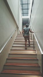 Low angle view of woman walking up stairs