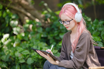 Young woman using mobile phone