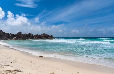 Idyllic empty sandy beach on tropical island