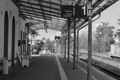 Empty railroad station platform in city