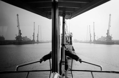 Midsection of man in boat sailing on sea