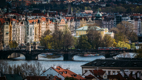 High angle view of bridge over river against buildings