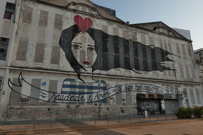 Low angle view of graffiti on building in city