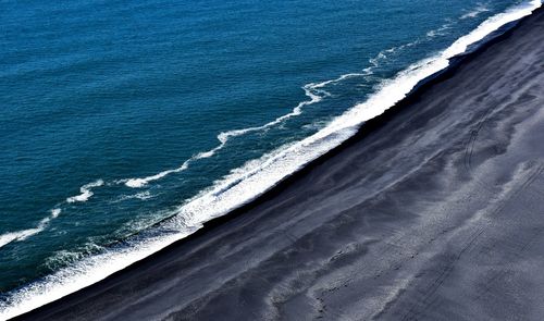 Scenic view of beach against clear sky