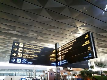 Low angle view of information sign at airport