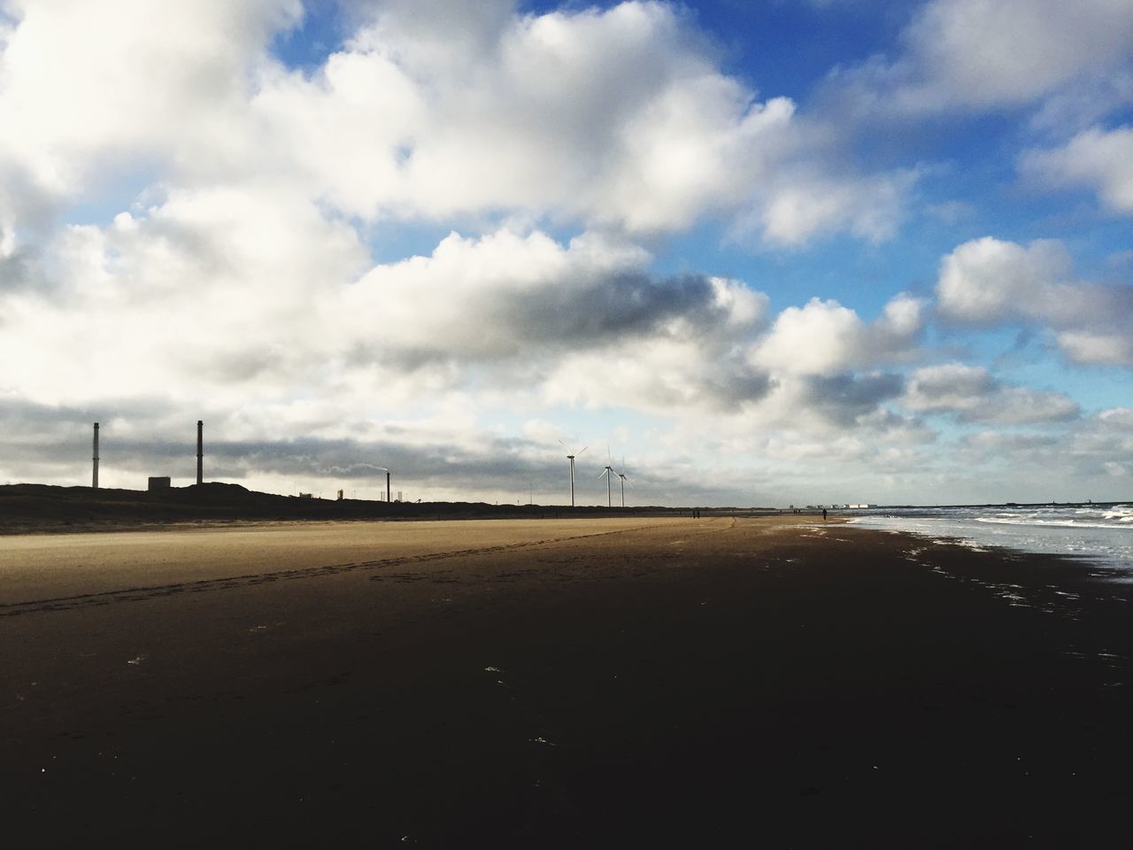 sky, cloud - sky, tranquility, beach, tranquil scene, sand, cloud, cloudy, sea, landscape, scenics, nature, beauty in nature, day, shore, outdoors, remote, road, water, non-urban scene