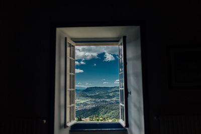 View of mountains through window
