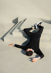 Man and woman lying down on floor