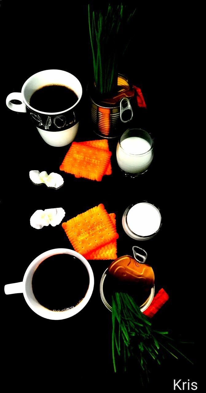 HIGH ANGLE VIEW OF TEA SERVED ON BLACK BACKGROUND