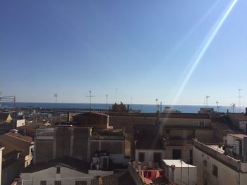 View of town against blue sky