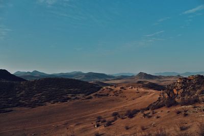 Scenic view of arid landscape against sky