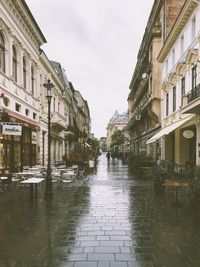 Street by city against sky