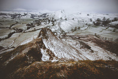 Scenic view of snow covered mountains against sky