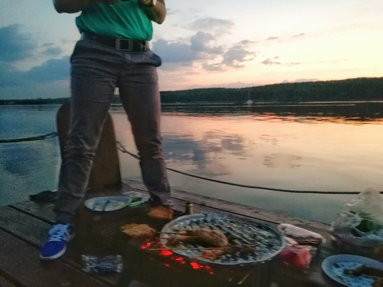 LOW SECTION OF MAN STANDING ON WATER