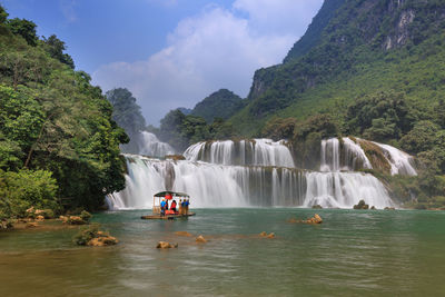 Scenic view of waterfall in river