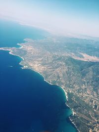 Aerial view of landscape and sea against sky