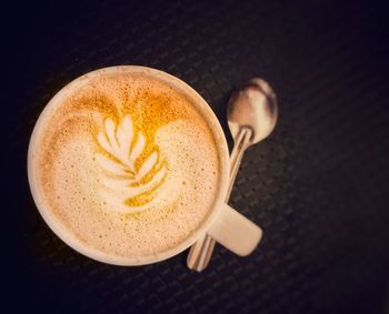 High angle view of cappuccino on table