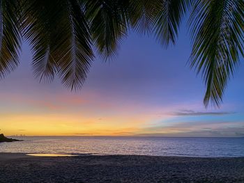 Scenic view of sea against sky at sunset