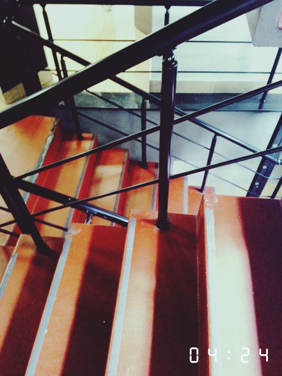 low angle view, built structure, indoors, metal, architecture, metallic, technology, no people, railing, day, sunlight, sky, connection, modern, pattern, part of, communication, red, safety