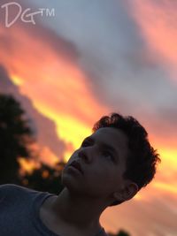 Close-up of man against sky during sunset