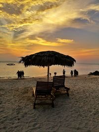 Scenic view of beach against sky during sunset