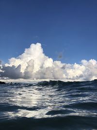 Scenic view of sea against blue sky