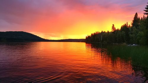Scenic view of lake at sunset