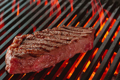 Close-up of meat on barbecue grill