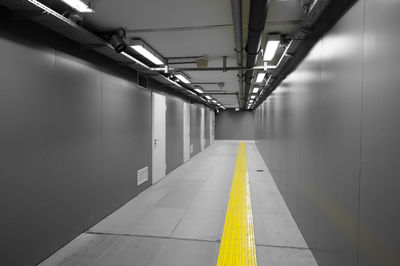 Empty long corridor along walls