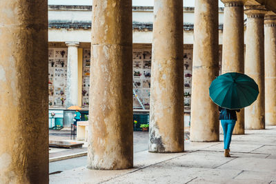 Rear view of man standing in city