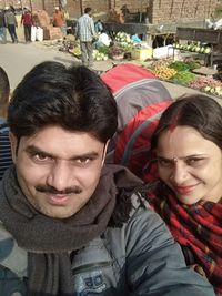 Portrait of smiling man and woman in winter