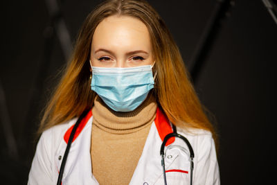 Portrait of young woman wearing mask