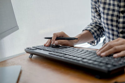 Man using laptop on table