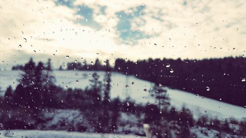 Full frame shot of wet glass window in rainy season