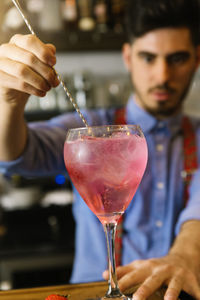 Bartender preparing drink in restaurant