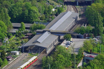 High angle view of railroad tracks by road in city