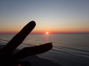 Close-up of sea against sky during sunset