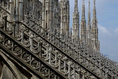 Low angle view of ornate building against sky