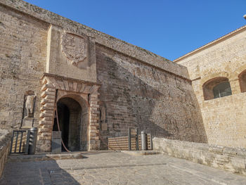 Low angle view of old building against sky