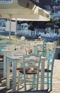 Empty chairs and tables in restaurant