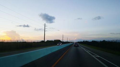 Road against sky during sunset