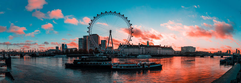 London ferris wheel in city at sunrise