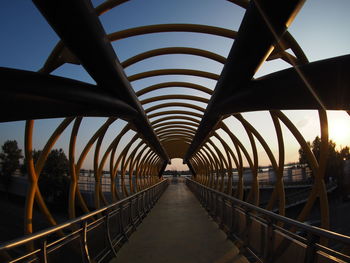 Bridge over footbridge against sky