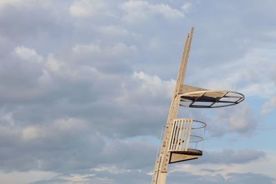 Low angle view of observation point against cloudy sky