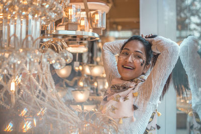 Portrait of smiling young woman in store