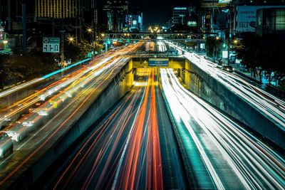 High angle view of light trails on road at night