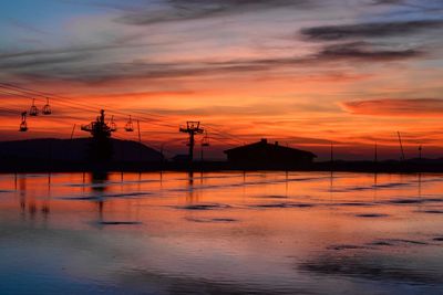 Scenic view of sea against orange sky