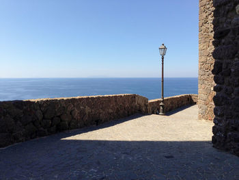 Scenic view of sea against clear blue sky