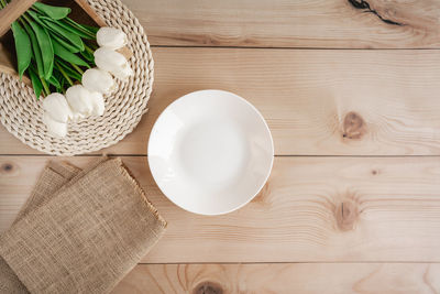 High angle view of eggs in basket on table